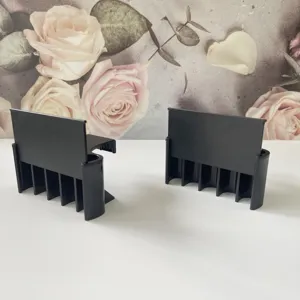 Detailed view of black plastic fish tank plant holder, perfect for aquarium setup.