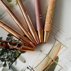 Close-up view showing exquisite details of a 6-piece rose gold glitter ballpoint pen set.