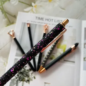 Exquisite black glitter ballpoint pen detail, elegant rose gold clip, smooth writing set.