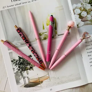 Detail shot of 6 piece pink ballpoint pen set featuring diamond and glitter designs.