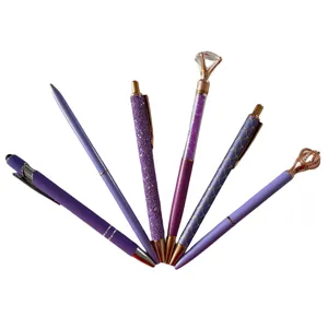 Detailed view of the 6-piece purple creative ballpoint pen set featuring sparkling diamond and crown tops.