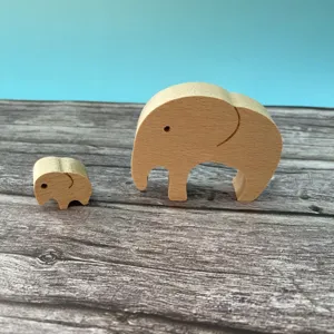 Close-up detail of cute wooden elephant mother and child figurine, ideal home decor gift.
