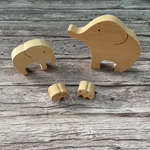 Detailed close-up of handmade wooden elephant figurines, showing smooth natural wood texture.
