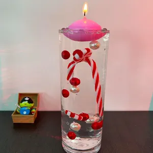 Set riempimento vaso con candela galleggiante rosa e decorazioni rosse per tavolo.