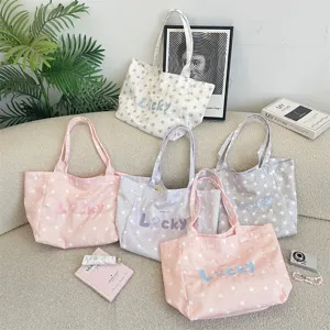Detailed view of colorful Korean style canvas tote bags with star patterns and embroidery.