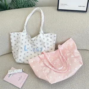 Detailed shot of star pattern and Lucky embroidery on Korean style canvas tote bags