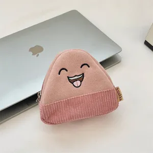 Detail view of a cute cartoon onigiri-shaped corduroy coin purse with embroidery