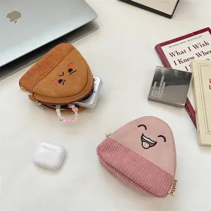 Close-up of cute cartoon onigiri corduroy coin purses for earphones and coins