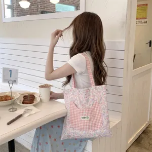 Pink floral canvas tote bag with cute cat-shaped gingham pocket for daily use