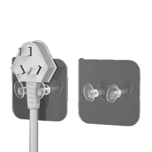 Gancho de pared transparente para enchufe y cable, adhesivo impermeable sin taladros.