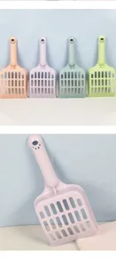 Plastic cat litter scoop with long handle and fine holes for daily pet cleaning use detail.