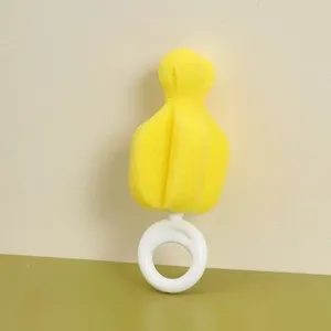 Yellow sponge baby bottle nipple brush with white ring handle for easy cup and pacifier cleaning