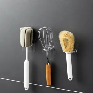 Gancho adhesivo de pared transparente para cocina y armario, colgador sin perforación vista principal.