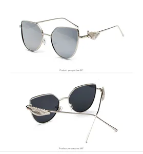 Detailed studio shots of silver cat-eye sunglasses featuring relief wing designs