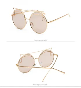 Macro detail views of stylish round oversized sunglasses with gold metal cat-eye frame