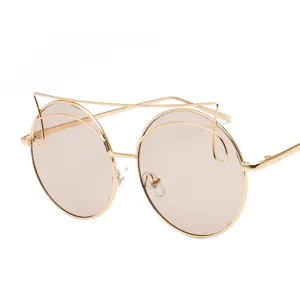 Trendy oversized round sunglasses for women with a unique golden wire cat-eye frame design