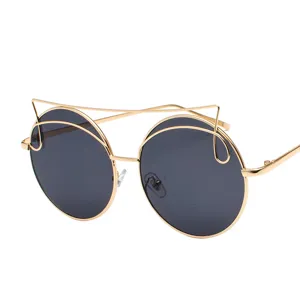 Trendy round sunglasses for women featuring a gold metal cat-eye style top bar