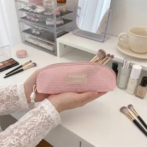 Portable pink mesh makeup brush storage bag in shell shape for travel cosmetics