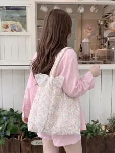 Beautiful pink floral canvas tote bag featuring a large white lace bow for daily use