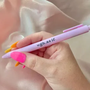 Detail view of a light purple retractable gel ink pen with a funny quote printed on the body.