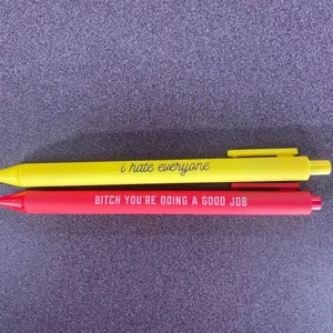 Detail view of funny quote gel pens with colorful barrels and unique English novelty text.