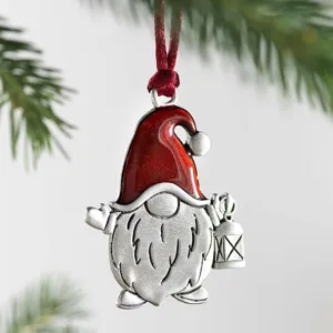 Detailed Christmas tree ornament featuring a cute metal gnome holding a lantern.