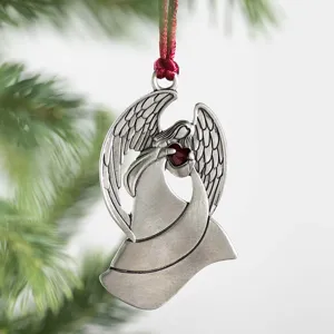 Metal angel Christmas tree ornament detailed close-up featuring red heart pendant holiday decor.