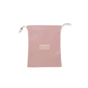 Minimalistische roze opbergtas met trekkoord voor make-up en kleine reisartikelen