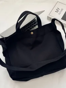 Bolso tote de lona negra de gran capacidad con correa ancha para estudiantes y trabajo