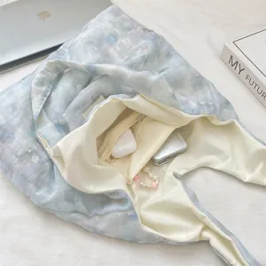 Detailed view of the blue floral tote bag interior showing spacious storage capacity