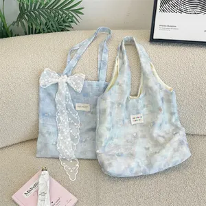 Two styles of Korean-style ice blue marbled floral tote bags with large lace bow