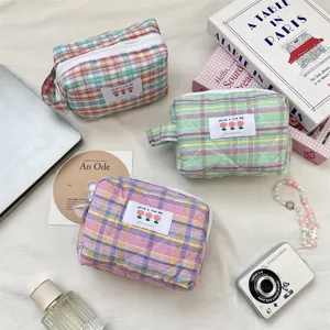 Pastel quilted plaid cosmetic bags with tulip label detail for stylish travel storage