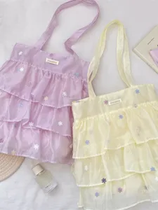 Bolsos tote de organza en violeta y amarillo con volantes y bordados de flores