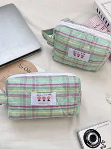Soft quilted checkered cosmetic bag with floral patch for daily travel organization
