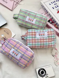 Quilted checkered cosmetic storage bags with zip closure and soft pastel fabric