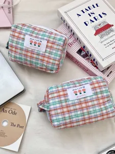 Soft pastel plaid quilted storage bag for portable makeup and travel organization