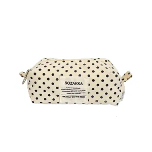Cream canvas cosmetic bag with black polka dots and Korean style patch display