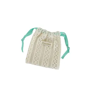 Elegant cream white hollow-out lace drawstring pouch for cosmetics and small accessories.
