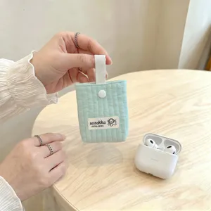 Mint green quilted earphone pouch for AirPods with snap button and white strap