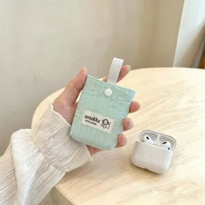 Mint green quilted small storage pouch for AirPods featuring a cute woven label