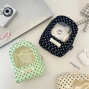 Detailed view of the mini polka dot doll display pouch featuring a clear PVC window for dolls