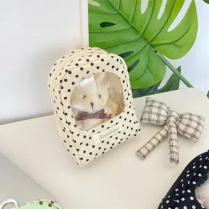 Polka dot plush doll display storage bag featuring transparent window for travel
