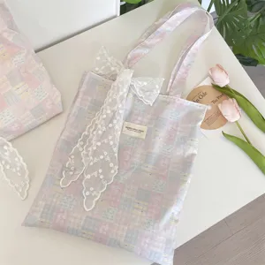 Pink and blue grid canvas tote bag featuring a white lace bow and vintage record decor