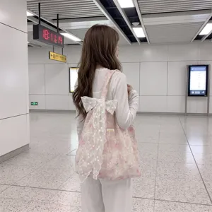 Stylish floral embroidered pink tote bag with large decorative lace bow for daily commuting
