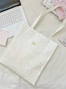 Minimalistische witte canvas draagtas met rode en blauwe stippen en Sorakka-label.