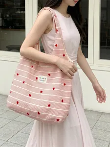 Pink and white striped tote bag featuring red heart embroidery for a casual girlish look