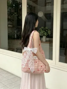 Pink and white striped tote bag with heart embroidery and elegant white lace bow