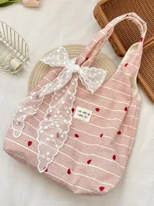 Pink and white striped tote bag with heart embroidery and a white lace bow detail.