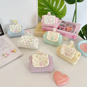 Quilted floral coin purse set in pastel colors with snap button closure for girls.