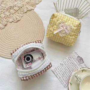 Quilted plaid makeup pouch with cute lace trim and bow, portable cosmetic storage bag.